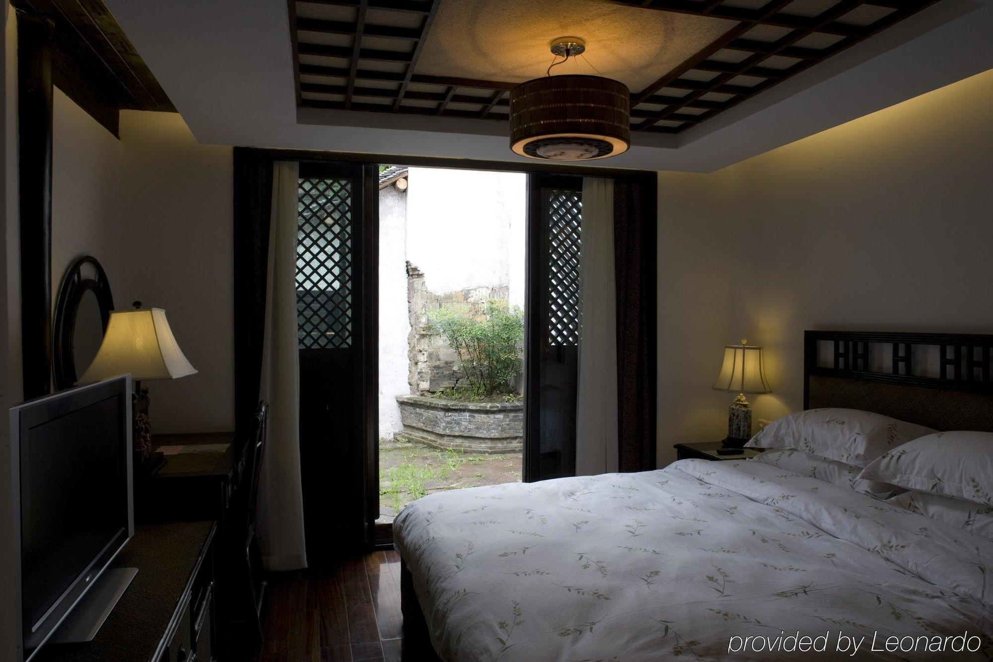Wuzhen Clubhouse Hotell Jiaxing Rom bilde
