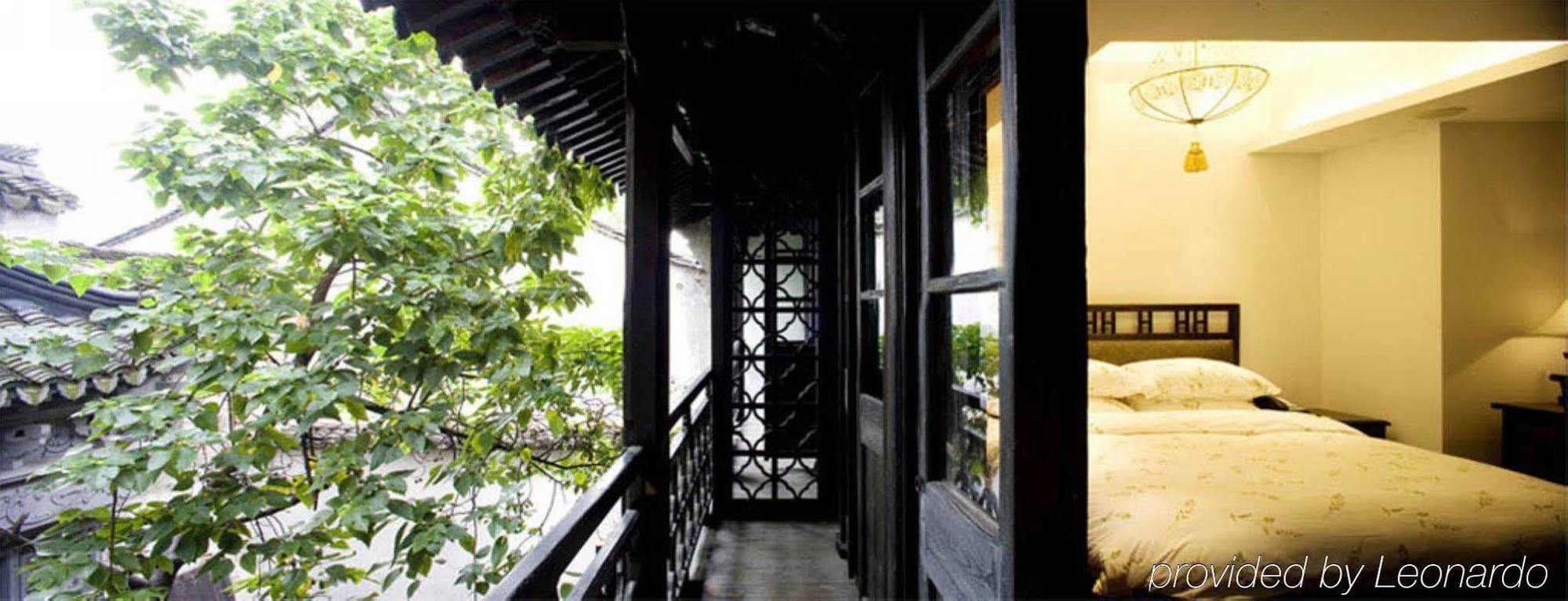 Wuzhen Clubhouse Hotell Jiaxing Rom bilde